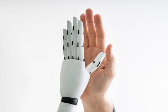 Robot And Man Giving High Five
